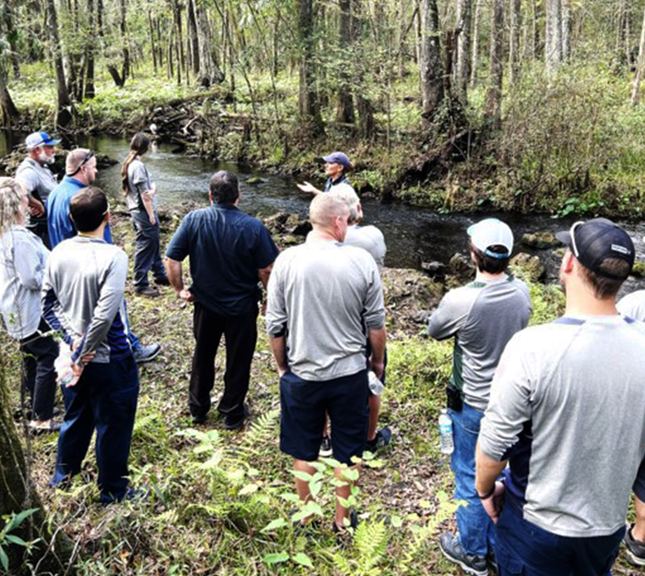Group of adults near a spring
